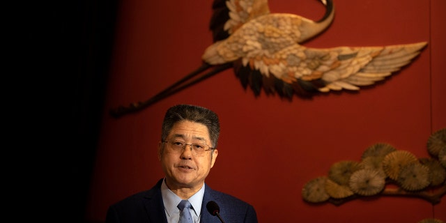 Chinese Vice Foreign Minister Le Yucheng speaks at a forum with experts arranged for foreign journalists in Beijing, Thursday, Dec. 2, 2021.