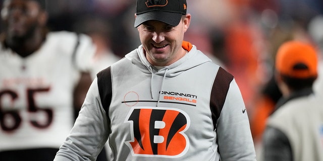 Cincinnati Bengals head coach Zac Taylor leaves the field after an NFL football game against the Denver Broncos, Sunday, Dec. 19, 2021, in Denver. The Bengals won 15-10.