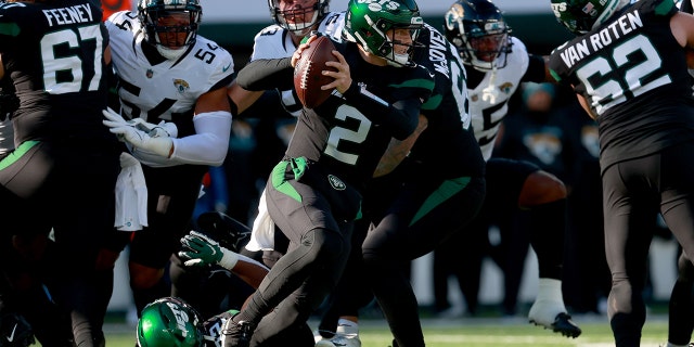 Zach Wilson (2) of the New York Jets scrambles during the first quarter in a game against the Jacksonville Jaguars at MetLife Stadium Dec. 26, 2021, in East Rutherford, N.J.