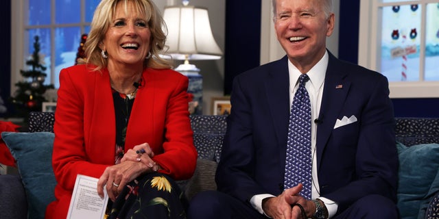 FILE: President Joe Biden and first lady Dr. Jill Biden participate in an event to call NORAD and track the path of Santa Claus on Christmas Eve in the South Court Auditorium of the Eisenhower Executive Building in Washington, DC.  (Photo by Alex Wong/Getty Images)