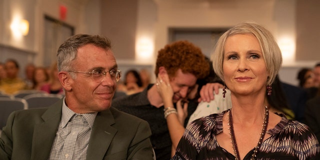 This image released by HBO Max shows David Eigenberg, left, and Cynthia Nixon in a scene from "And Just Like That."