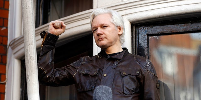 FILE - Julian Assange greets supporters outside the Ecuadorian embassy in London, May 19, 2017. 