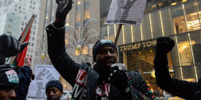 Hawk Newsome leads a chant during a Black Lives Matter protest in front of Trump Tower in New York City, U.S. January 14, 2017.