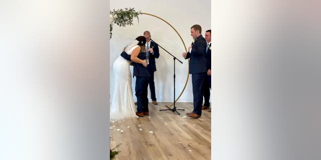 Henry, 9, immediately hugged his new mother-in-law - Vanessa Lynch, 30 - after saying heartfelt wishes to her on her wedding day.