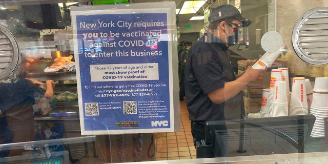 Vaccine Mandate sign at Burger King Fast food restaurant, Queens, New York.