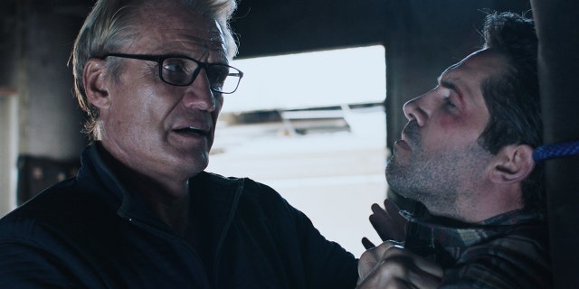 L-R] Dolph Lundgren as Sheaand Scott Adkins as Mike in the action/thriller film, "Castle Falls", a Shout! Studios release.