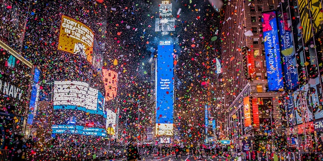 Confetti flies after the Times Square New Year's Eve Ball drops in a nearly empty Times Square due to COVID-19 lockdown, early Friday, Jan. 1, 2021. 