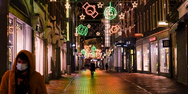 Amsterdam's streets are near-empty at 5 p.m. Monday, Nov. 29, 2021, after the Netherlands' tougher COVID-19 lockdown went into effect.