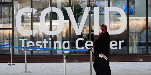 A traveler arrives to enter a COVID-19 testing center at the Incheon International Airport In Incheon, South Korea, Wednesday, Dec. 1, 2021.