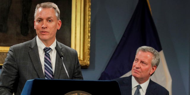 New York City Police Department Chief of Detectives and incoming Commissioner, Dermot Shea speaks as New York City Mayor Bill de Blasio looks on during a news conference. November 4, 2019. REUTERS/Brendan McDermid