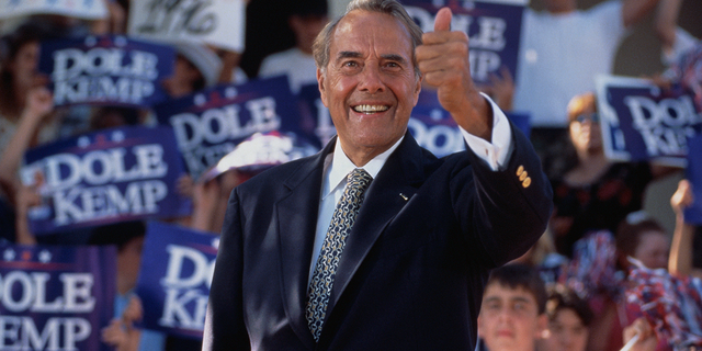 Senator Bob Dole gives the "thumbs up" sign during a presidential rally. Senator Dole won the Republican nomination for president in 1996, but lost the election to Bill Clinton. 