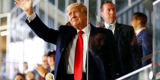 Former President Donald Trump, seen at a World Series game in Atlanta on Oct. 30, remains very much in the public eye despite having left office.