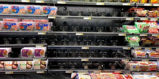 A nearly empty Wegmans grocery store shelf in a DC suburb