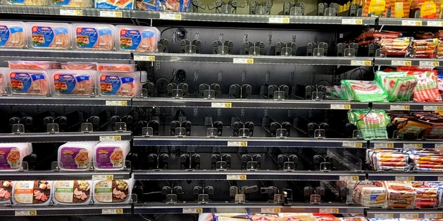 A nearly empty Wegmans grocery store shelf in a DC suburb