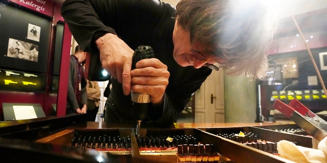 Paul McNulty renovates Chopin's last piano in Warsaw, Poland, on Thursday, Dec. 9, 2021. Chopin, Poland’s best known and beloved classical music composer and pianist, was born in 1810 in Zelazowa Wola, near Warsaw, to a Polish mother and a French father.