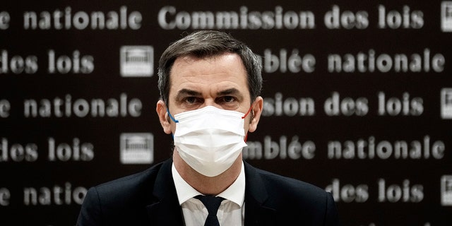 French Health Minister Olivier Veran arrives for a hearing with the deputies of the Laws Commission, at the National Assembly in Paris, France, Wednesday, Dec. 29, 2021. 