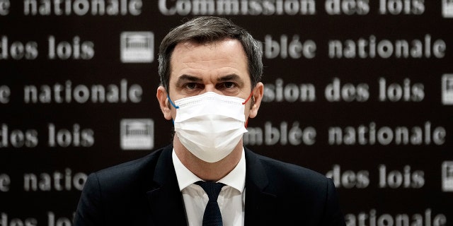 French Health Minister Olivier Veran arrives for a hearing with the deputies of the Laws Commission, at the National Assembly in Paris, France, Wednesday, Dec. 29, 2021.