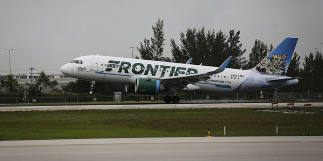  A Frontier Airlines airplane lands at Miami International Airport, in Miami, Florida, United States on June 16, 2021. A passenger was arrested Tuesday after allegedly making a bomb threat, causing the partial evacuation of Palm Beach International Airport in Florida. 