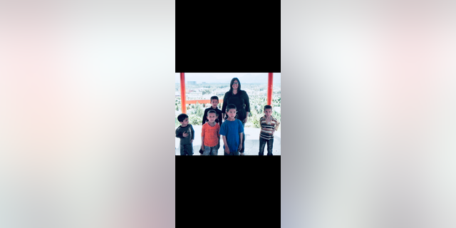 Geeta Bakshi, a former CIA officer, with Afghan children.