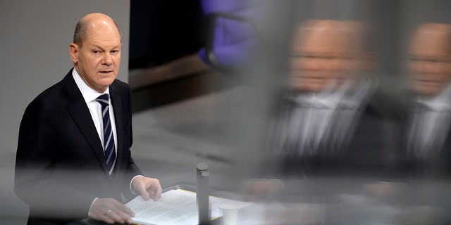 German Chancellor Olaf Scholz delivers a speech during a meeting of the German federal parliament, Bundestag, at the Reichstag building in Berlin, Germany Dec. 15, 2021. 