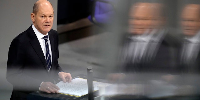 German Chancellor Olaf Scholz delivers a speech during a meeting of the German federal parliament, Bundestag, at the Reichstag building in Berlin, Germany, Dec. 15, 2021.