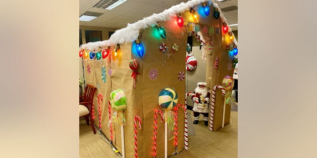 Orrey arrived on a Sunday and spent eight hours building his gingerbread house out of cardboard, duct tape and other decorations. (SWNS)