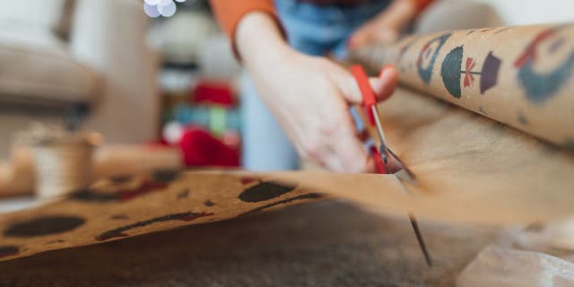 DIY crafter and art lover Lauren Campanella (not pictured) shared a gift wrap idea on TikTok, which showed users that they can put their wrapping paper scraps to good use.