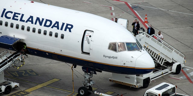 FILE: A passenger on an Icelandair flight said she voluntarily quarantined inside the bathroom of a plane for four hours after learning she had COVID-19. (Photo by Bernd von Jutrczenka/picture alliance via Getty Images)