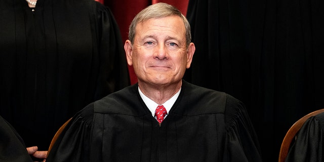 Chief Justice John Roberts sits during a group photo of the Justices at the Supreme Court in Washington, D.C., on April 23, 2021. 