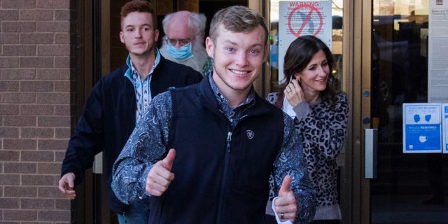 Justin Duggar is seen here giving two thumbs up while leaving the courthouse where his brother Josh is on trial.