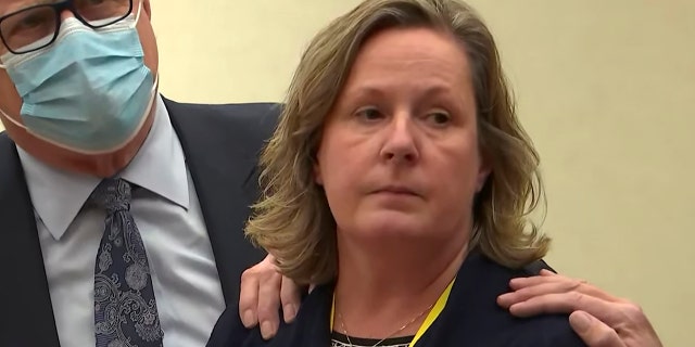 In this screen grab from video, former Brooklyn Center Police Officer Kim Potter stands with defense attorney Earl Gray, as the verdict is read Thursday, Dec. 23, 2021, at the Hennepin County Courthouse in Minneapolis, Minn.
