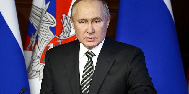 Russian President Vladimir Putin addresses an extended meeting of the Russian Defense Ministry Board at the National Defense Control Center in Moscow, Russia, Dec. 21, 2021.