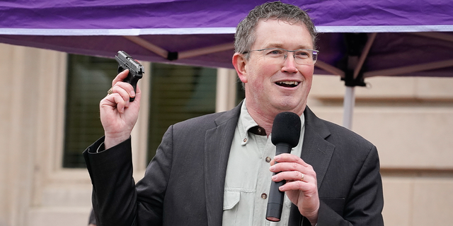 Rep Thomas Massie (R-KY) draws a Ruger LCP handgun from his pocket during a rally in support of the Second Amendment on January 31, 2020 in Frankfort, Kentucky. 