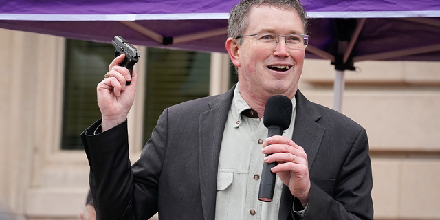 FRANKFORT, KY - JANUARY 31: Rep Thomas Massie (R-KY) draws a Ruger LCP handgun from his pocket during a rally in support of the Second Amendment on January 31, 2020 in Frankfort, Kentucky. Advocates from across the state gathered at the Kentucky Capitol in support of the Second Amendment. The rally will include speeches from Rep. Thomas Massie (R-KY) and former Washington, D.C. Special Police Officer, Dick Heller. 