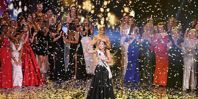 Miss Alaska Emma Broyles waves in confetti after being crowned Miss America, Thursday, Dec. 16, 2021, at Mohegan Sun in Uncasville, Conn. 