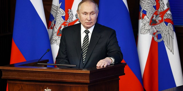 Russian President Vladimir Putin addresses an extended meeting of the Russian Defense Ministry Board in Moscow on Dec. 21, 2021.