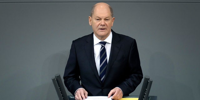 German Chancellor Olaf Scholz delivers a speech during a meeting of the German federal parliament in Berlin on Dec. 15, 2021.
