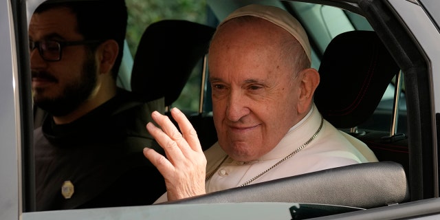 Pope Francis waves as he arrives at the Apostolos Varnavas Orthodox Cathedral in Nicosia, Cyprus, Friday, Dec. 3, 2021. 