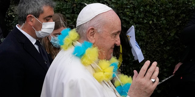 Pope Francis arrives for a meeting with young people at the Saint Dionysius School of the Ursuline Sisters in Athens, Greece, Monday, Dec. 6, 2021. 