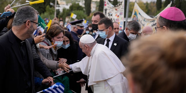 Pope Francis visits Saint Dionysius School of the Ursuline Sisters in Athens, Greece, Monday, Dec. 6, 2021. 