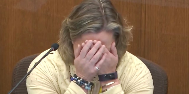 In this screen grab from video, former Brooklyn Center Police Officer Kim Potter becomes emotional as she testifies in court, Friday, Dec. 17, 2021. (Court TV, via AP, Pool)