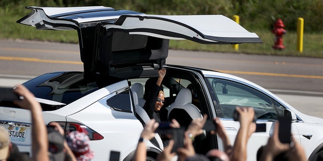 Sian Proctor was ferried to the launch pad in a Tesla Model Y.