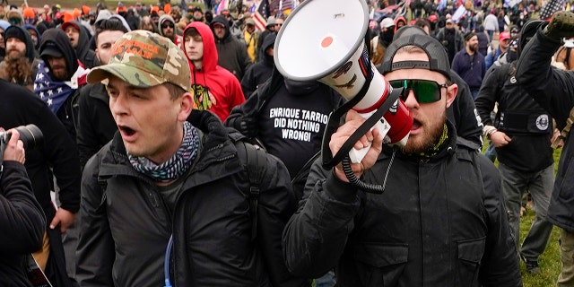 Proud Boys members Zachary Rehl, left, and Ethan Nordean, left, walk toward the U.S. Capitol in Washington, in support of President Donald Trump on Jan. 6, 2021. 