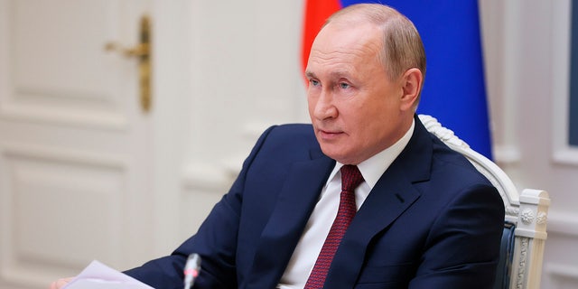 Russian President Vladimir Putin attends a video call of the VTB Capital "Russia Calling!" Investment Forum in Moscow, Russia. (Mikhail Metzel, Sputnik, Kremlin Pool Photo via AP)