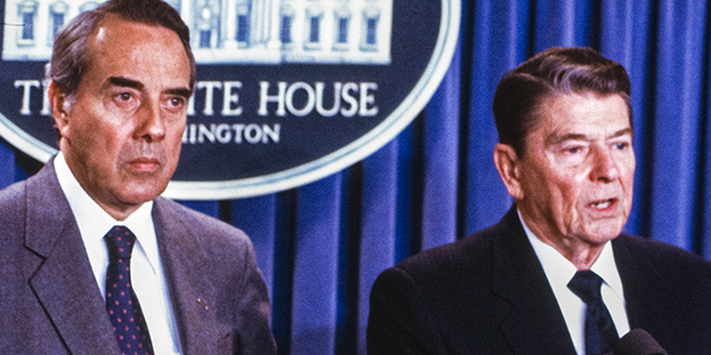 Pres. Ronald W. Reagan (R) stands with Senator Robert J. Dole of Kansas in the White House press conference room.  (Photo by Dirck Halstead / Getty Images)