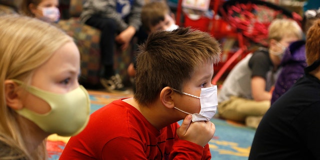 Second-graders listen to a lesson at Paw Paw Elementary School on Thursday, Dec. 2, 2021, in Paw Paw, Michigan. 