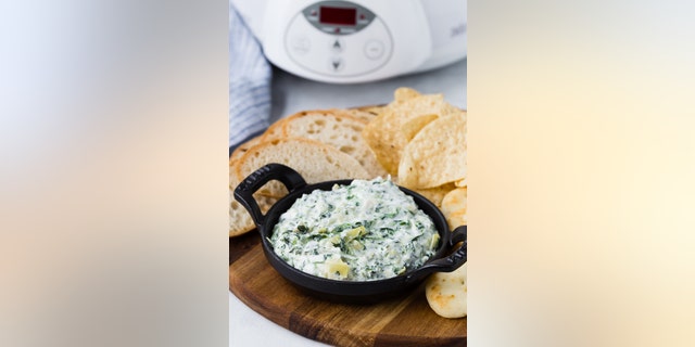 This spinach artichoke dip can be served with tortilla chips or crackers.