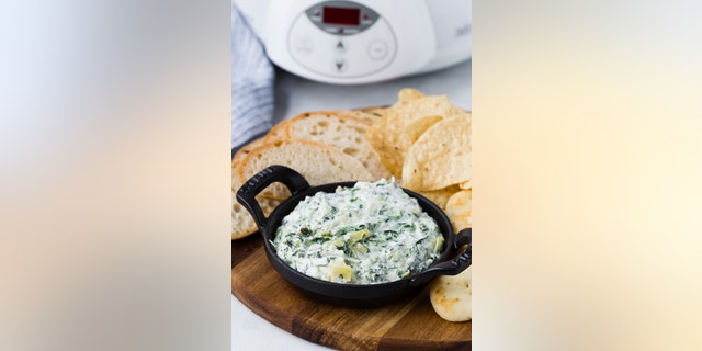 This spinach artichoke dip can be served with tortilla chips or crackers.