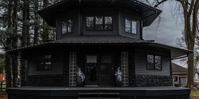 The house was built in 1993, although it wasn't painted black until last summer.