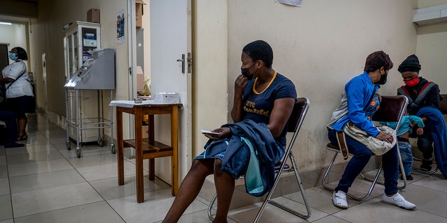 People wait to be vaccinated against COVID-19 at the Hillbrow Clinic in Johannesburg, South Africa, Monday Dec. 6, 2021. The new omicron variant appears to be driving a dramatic surge in South Africa, providing the world a glimpse of where the pandemic might be headed. 